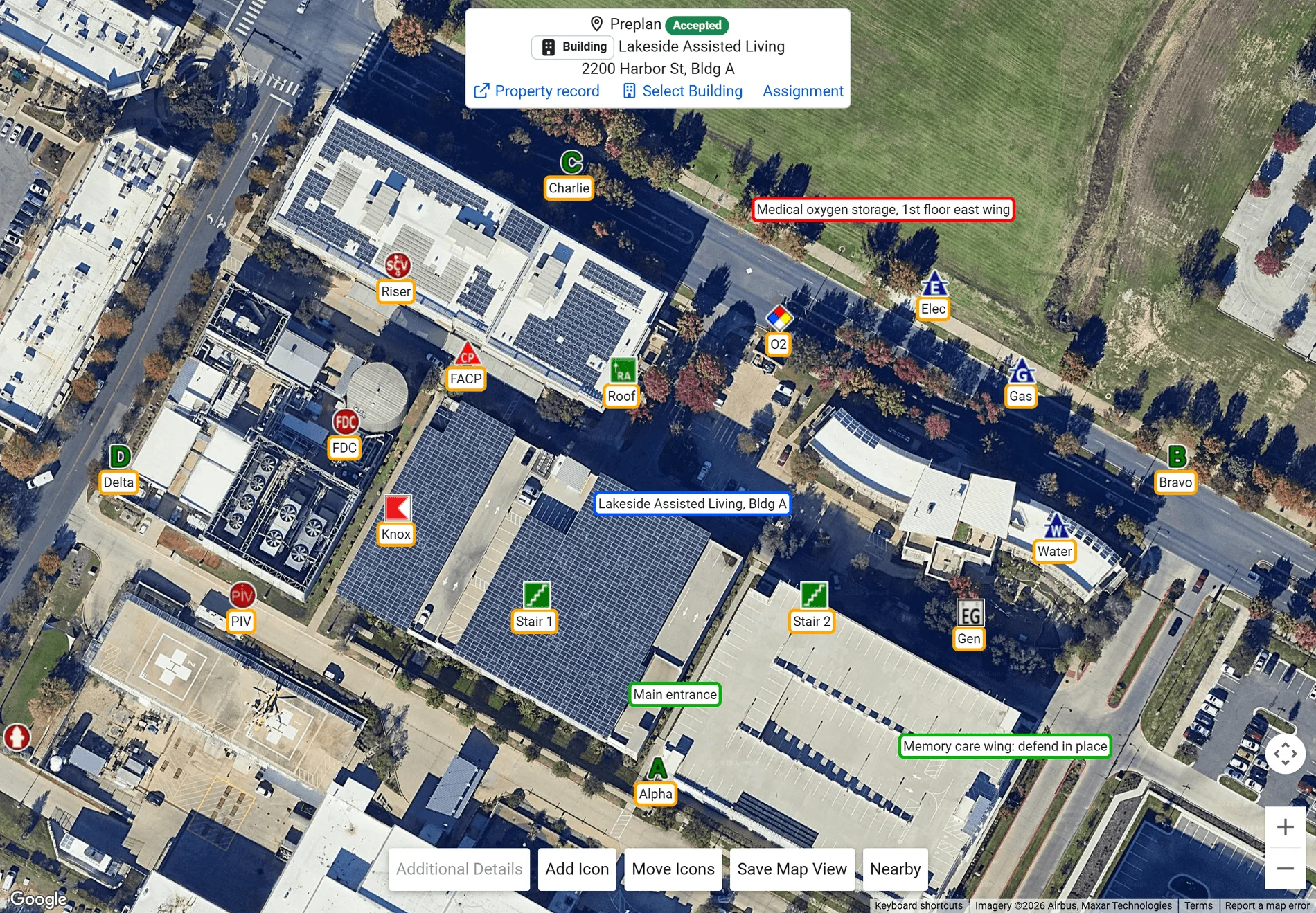The preplan map: satellite imagery of the building with the FDC, PIV, sprinkler riser, fire alarm panel, key box, electrical, gas and water shutoffs, generator, stairways, roof access, medical oxygen and the Alpha to Delta sides placed as icons, text boxes for the main entrance, a hazard and the memory care wing, hydrants nearby, and the preplan header with the property record, building and assignment links (sample data)